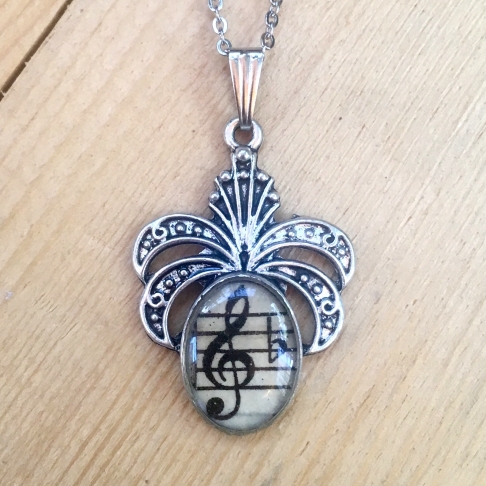Fancy Treble Clef Pendant by Emily McDonald | Silver plated copper, epoxy resin, vintage sheet music, stainless steel chain Fancy Treble Clef Pendant