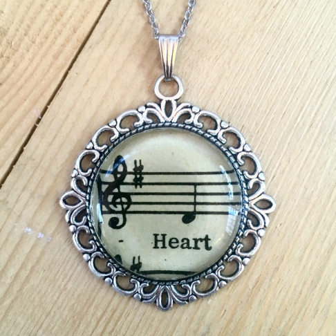 Music of the Heart Necklace by Emily McDonald | Silver plated copper, epoxy resin, sheet music, stainless steel chain Music of the Heart Necklace