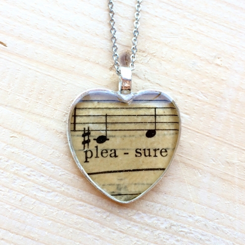 Heart's Pleasure Music Necklace by Emily McDonald | Silver plated copper, epoxy resin, sheet music, stainless steel chain Heart's Pleasure Music Necklace