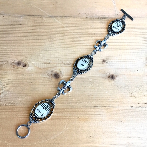 Peace On Earth Music Bracelet by Emily McDonald | Silver plated copper, vintage sheet music, epoxy resin Peace On Earth Music Bracelet